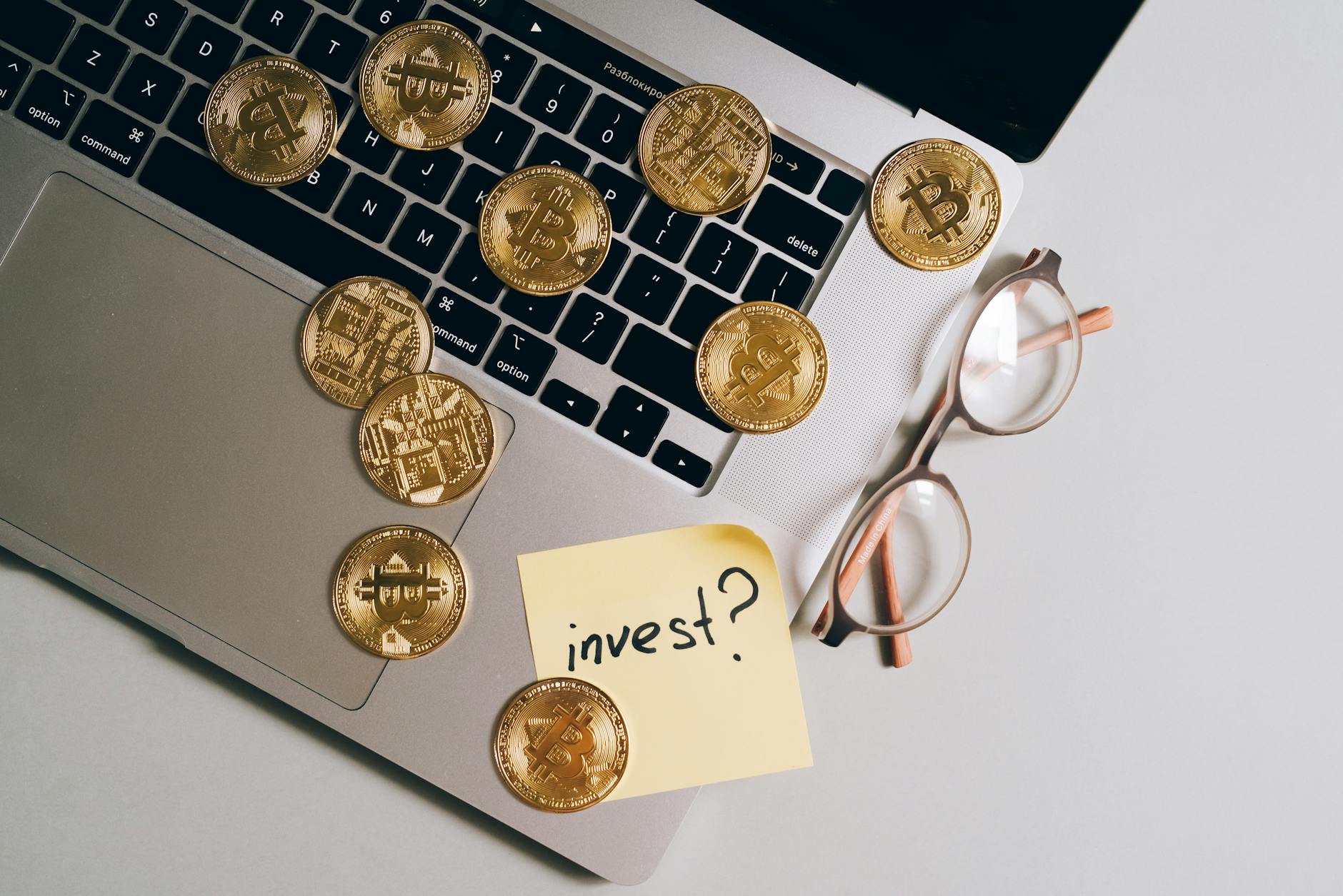 bitcoins over a laptop keyboard